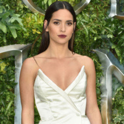 Adria Arjona says her curly hair is her secret weapon